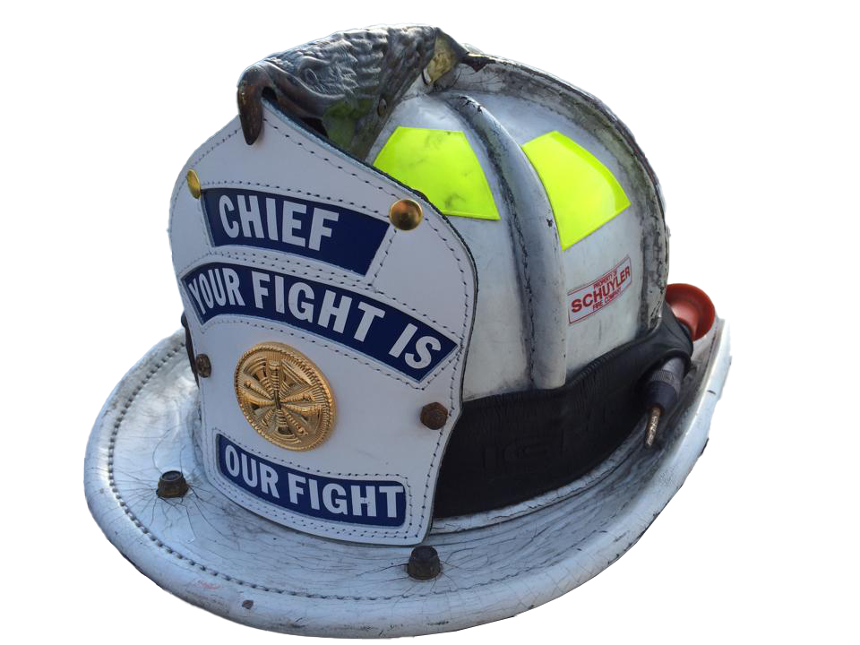 A white firefighter helmet with yellow reflective markings, a decorative eagle on top, and a shield labeled "CHIEF" and "YOUR FIGHT IS OUR FIGHT." The helmet shows signs of wear.